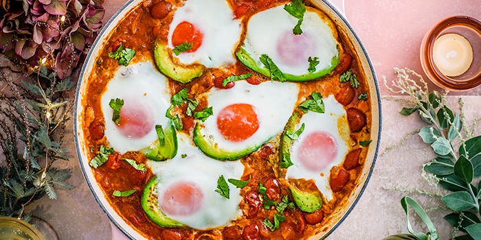 Tex-Mex Baked Avocado Tex-Mex Baked Avocado and Eggs in a White Casserole Dish