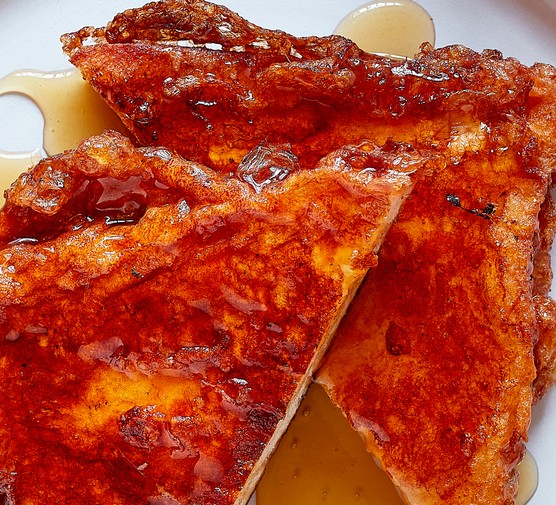 Torrijas with honey on a plate