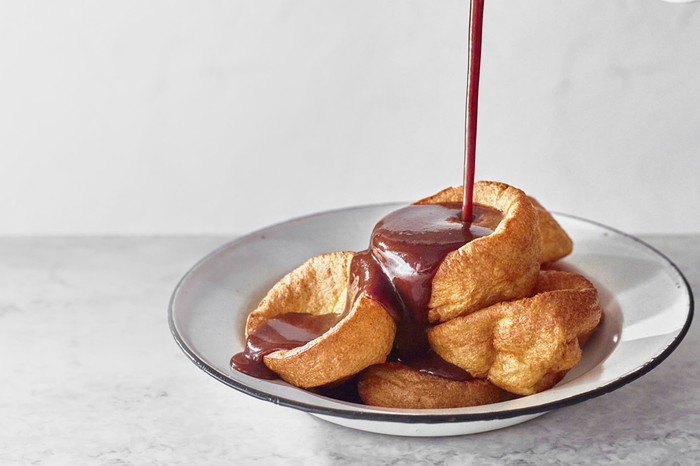 Beef Gravy Recipe A plate of Yorkshire pudding with gravy being poured over