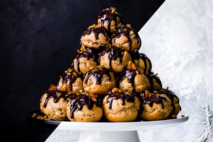 Profiterole tower with dark chocolate and hazelnut topping
