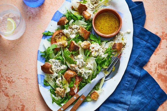 Za’atar cottage cheese salad Platter of cottage cheese salad with a dip in a ramekin
